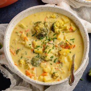photo of creamy vegan broccoli potato soup in white bowl