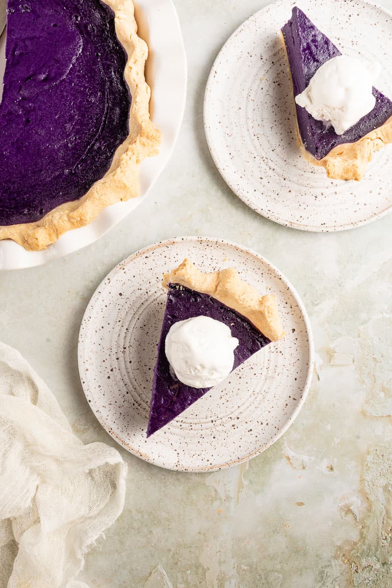 overhead image of ube pie on a plate with ice cream