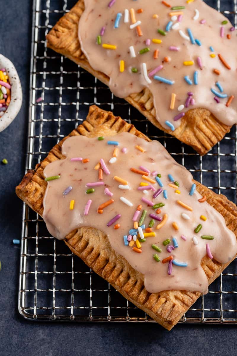 close up of vegan pop tart with pink icing and sprinkles