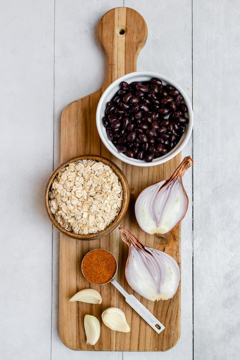 ingredients for black bean burgers on wooden cutting board