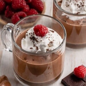 chocolate mousse in cup with whipped cream and fruit