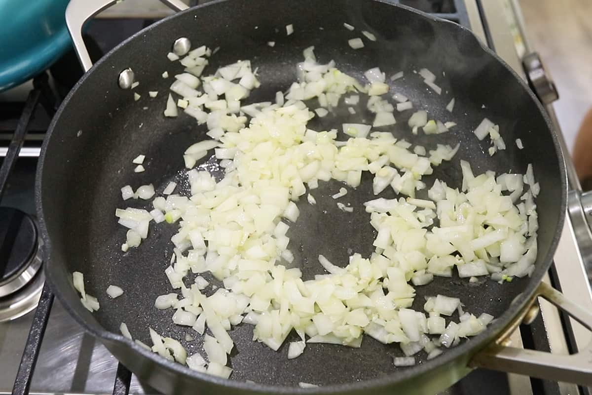 sautéing onions in black pan