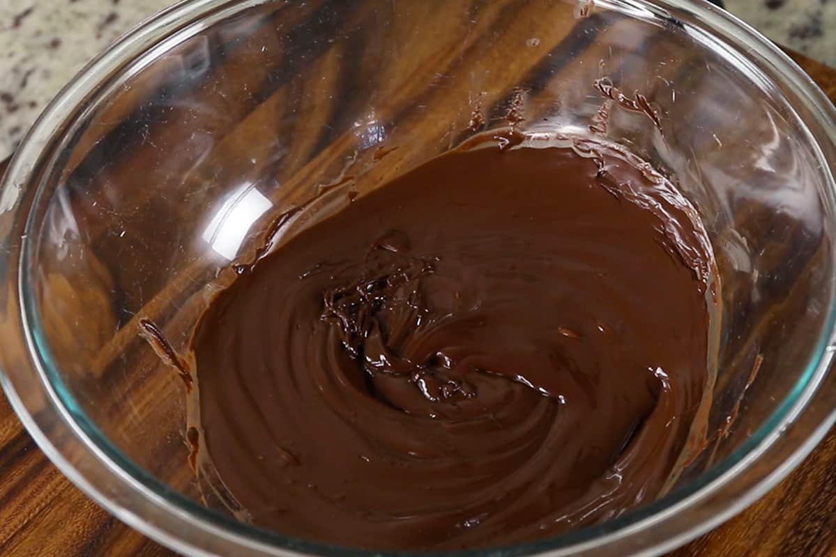 melted dark chocolate in glass bowl
