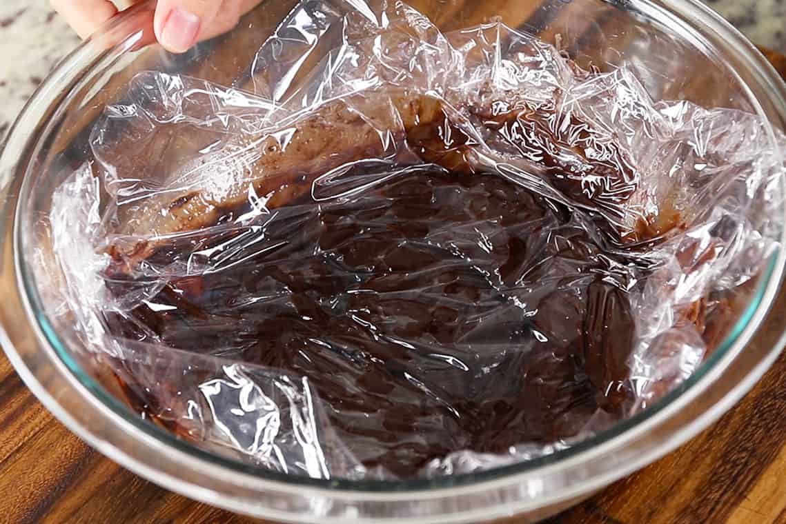 chocolate truffle dough covered with plastic wrap