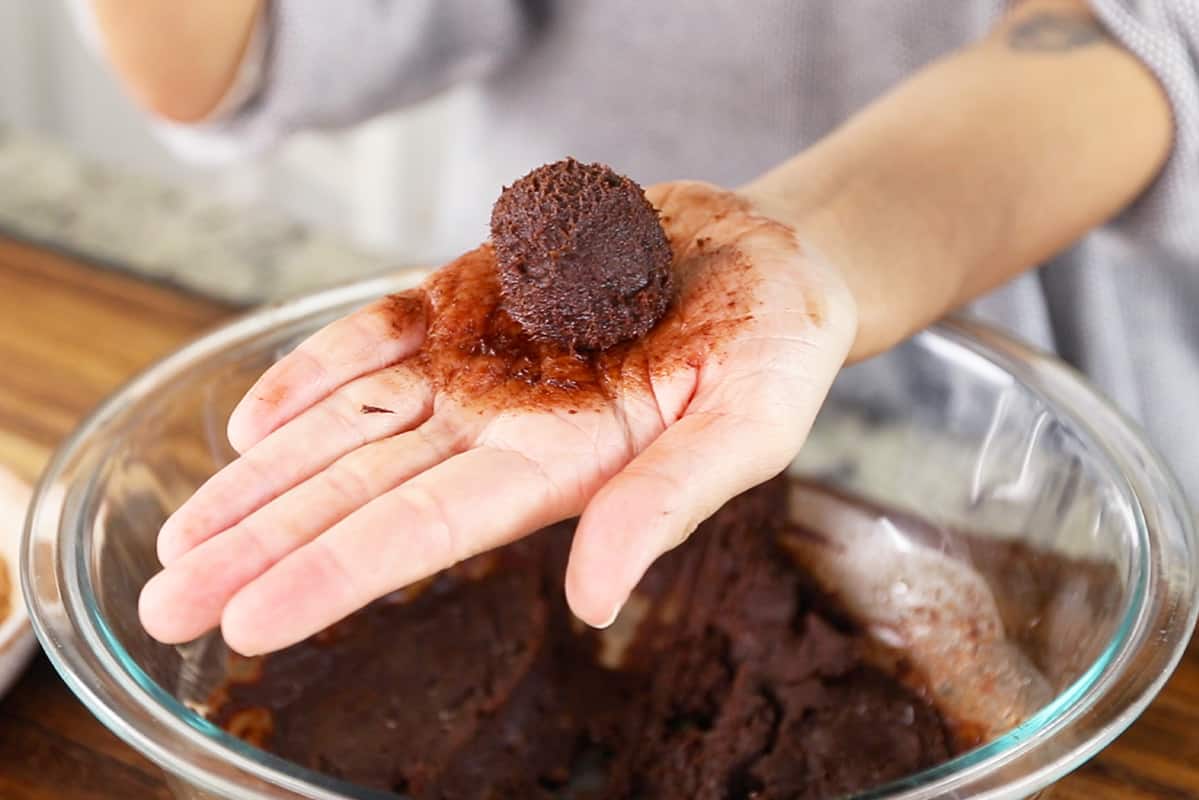 chocolate truffle ball in hand