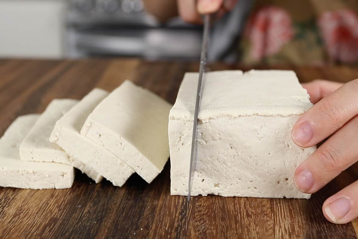 slicing pressed tofu