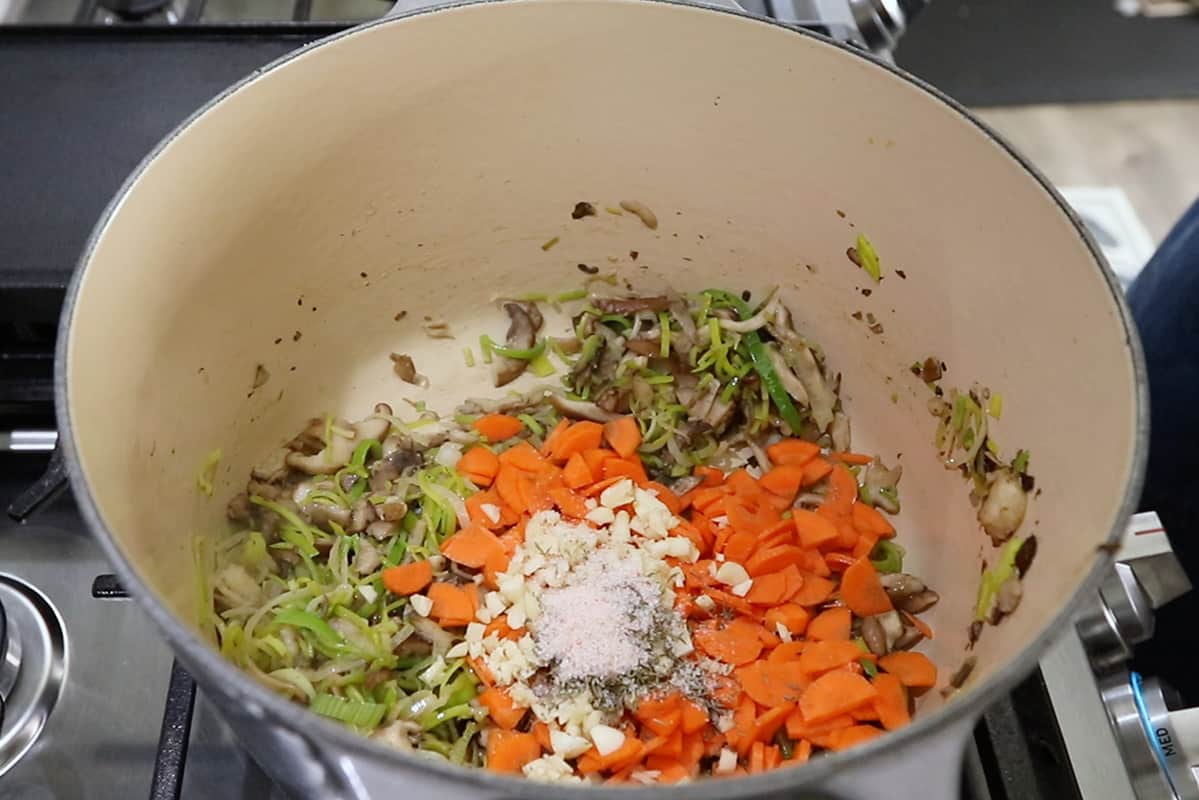 mushrooms leeks carrots garlic and spices in pot