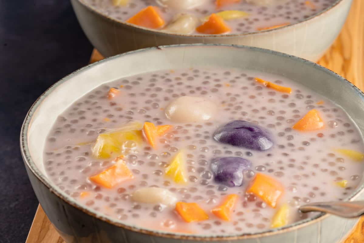 close up horizontal photo of ginataang bilo biilo in gray bowls with metal spoon
