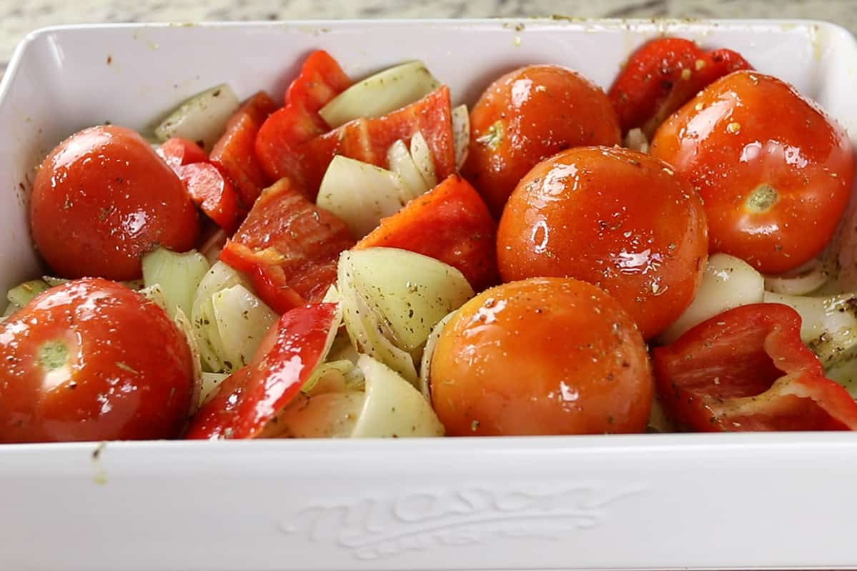 ingredients for roasted red pepper sauce in white baking dish