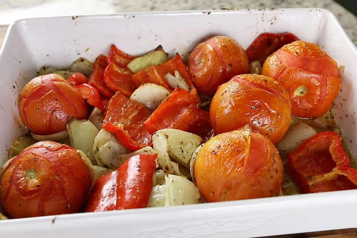 ingredients for roasted red pepper sauce in white baking dish