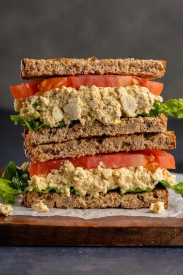 photo of a sliced open vegan tofu egg salad sandwich