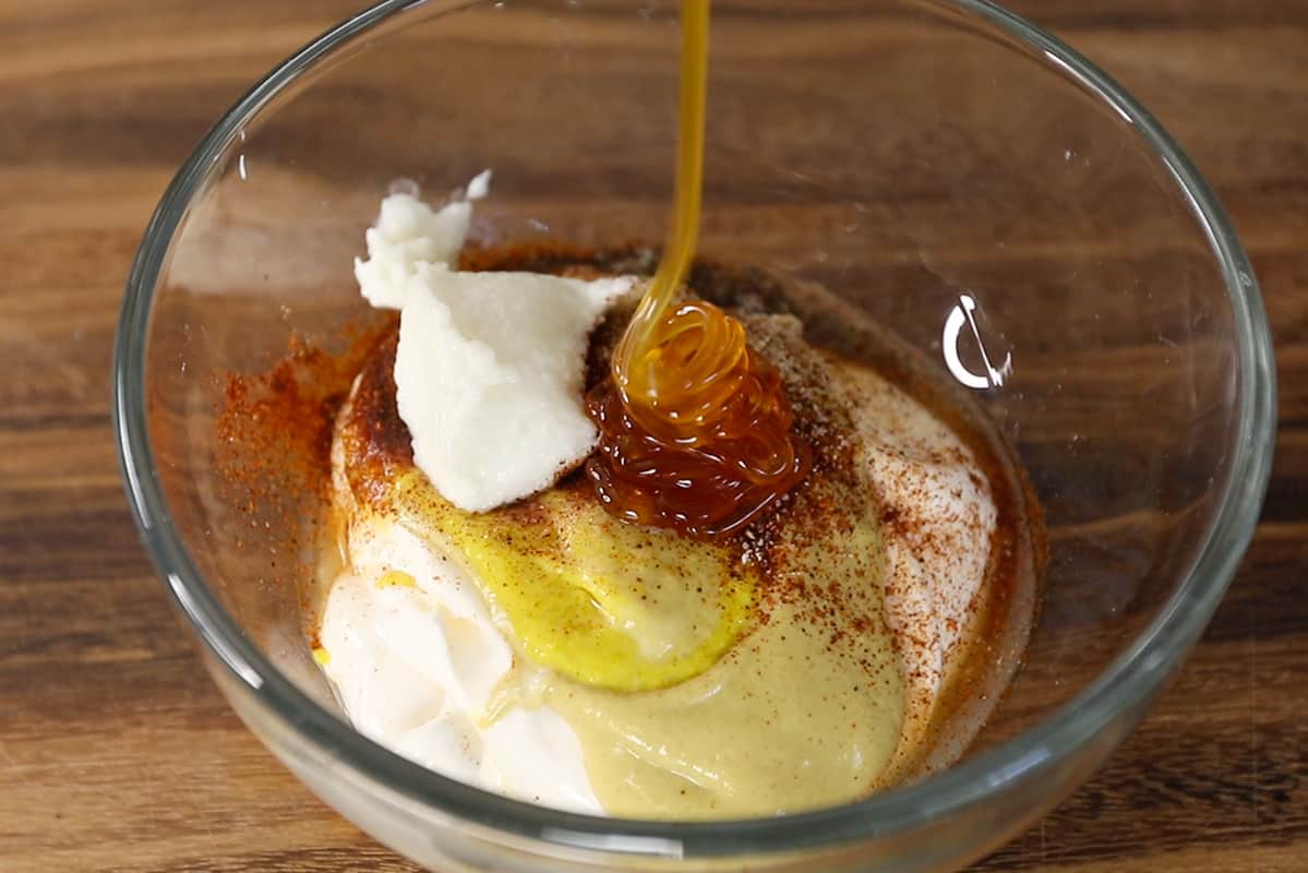 ingredients for vegan honey mustard dressing in glass bowl