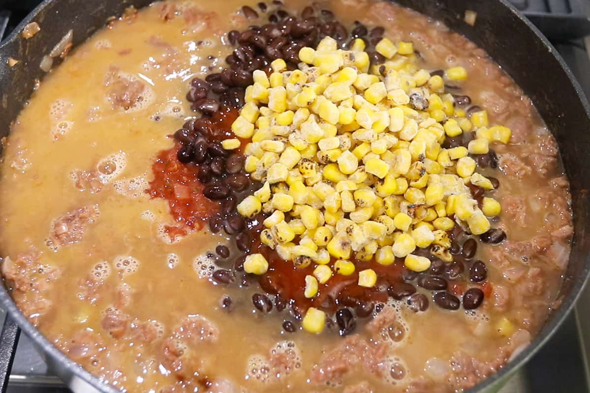 making vegan taco pasta in black pan