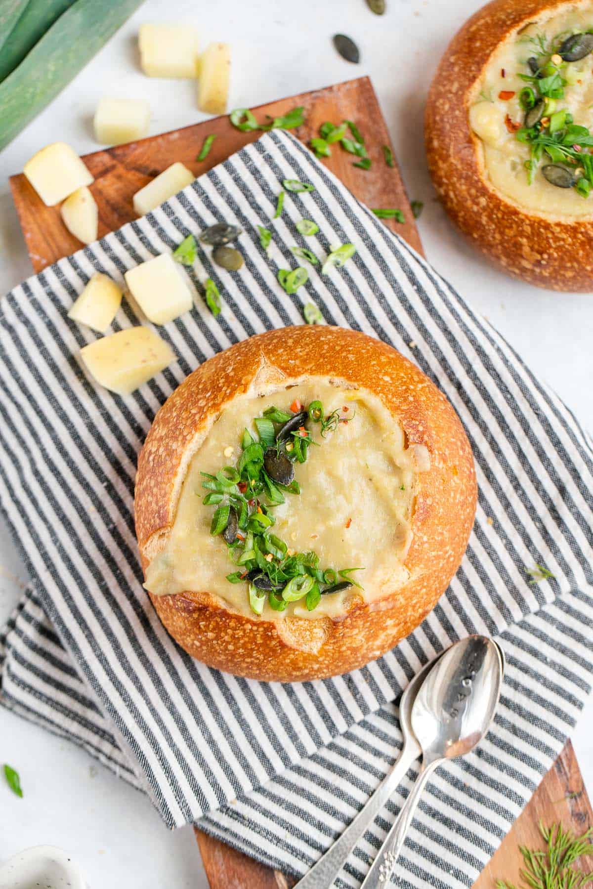 bread bowl filled with vegan potato leek soup