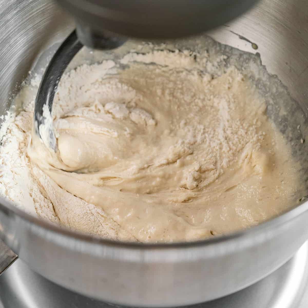 making pita bread dough in a stainless steel standing mixer
