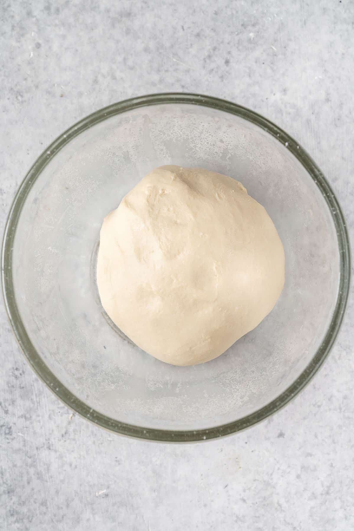 pita bread dough in glass bowl