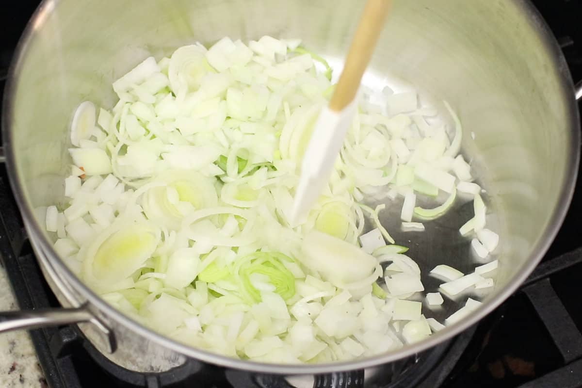 cooking potato leek soup in a stainless steel pot