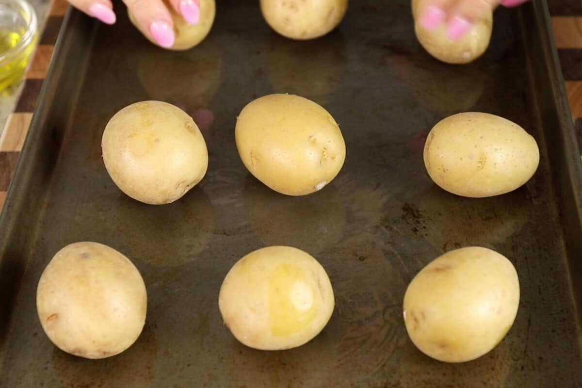boiled potatoes on metal baking sheet
