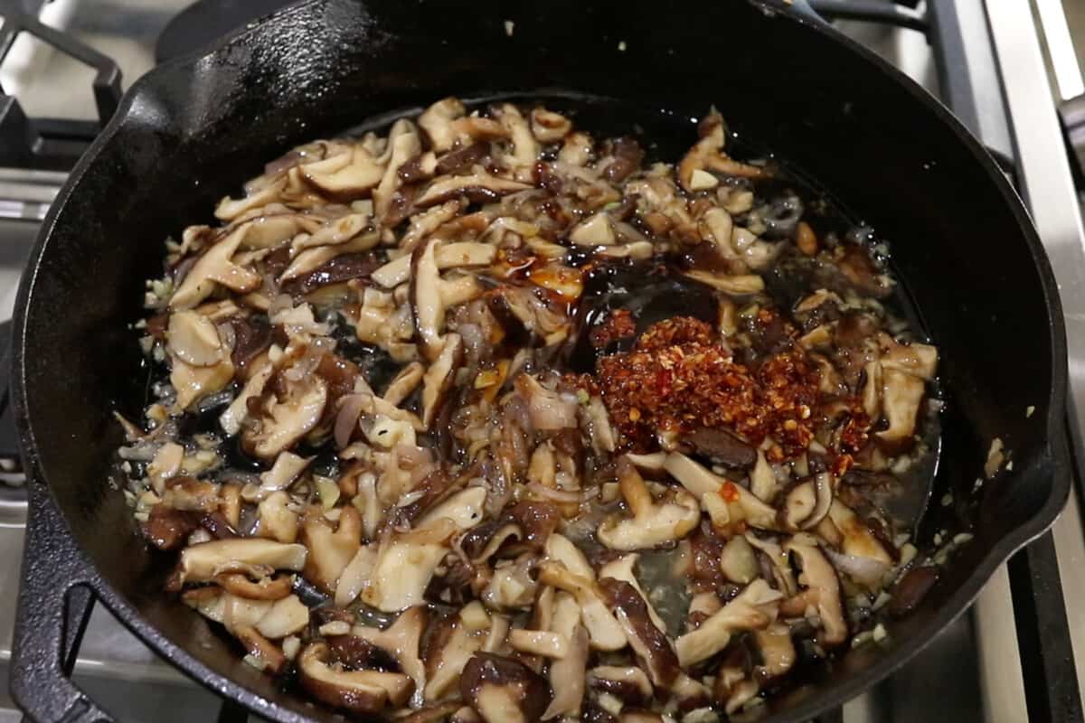 sautéed mushrooms and chili crisp in cast iron skillet
