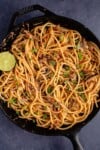Spicy Chili Crisp Garlic Noodles in cast iron pan