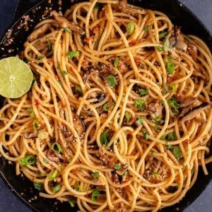 Spicy Chili Crisp Garlic Noodles in cast iron pan
