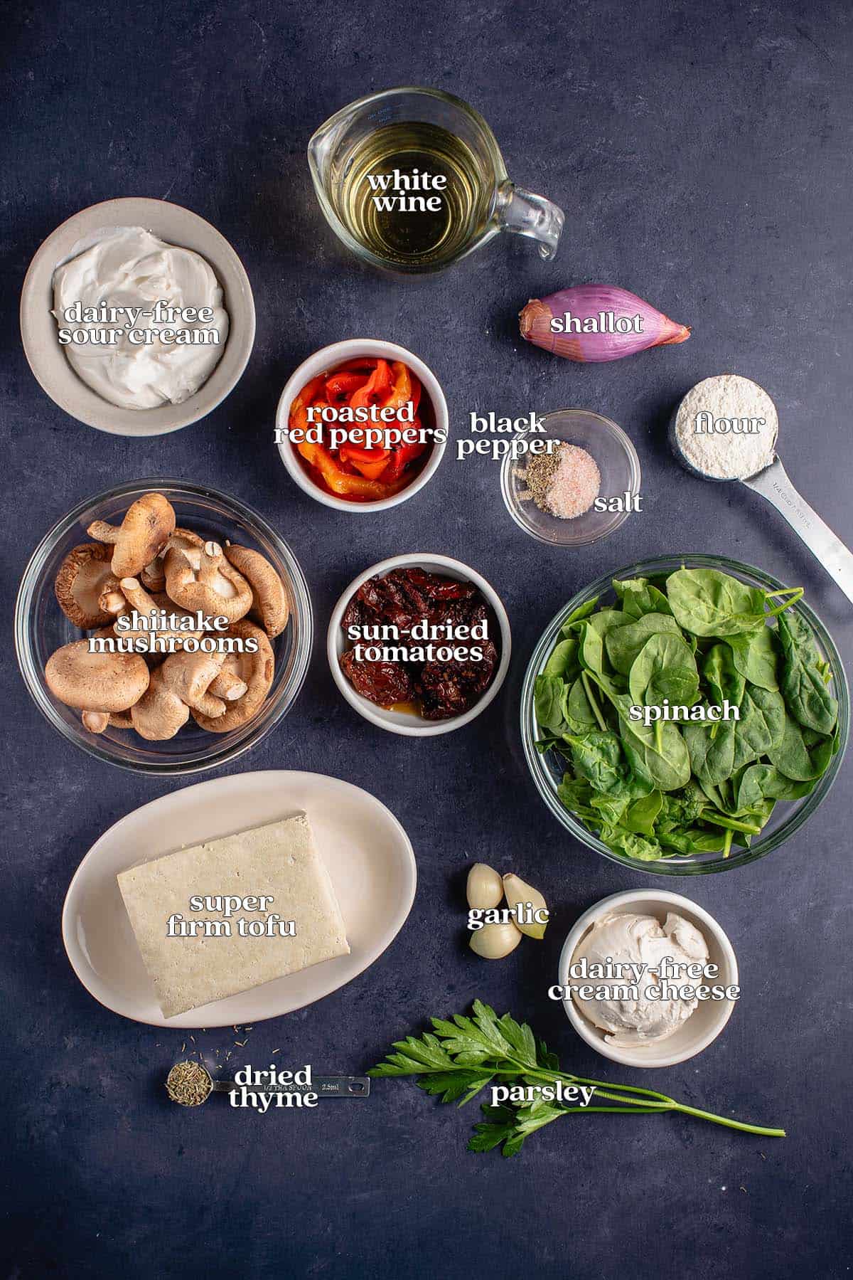 labeled ingredients for tuscan vegan chicken on blue board