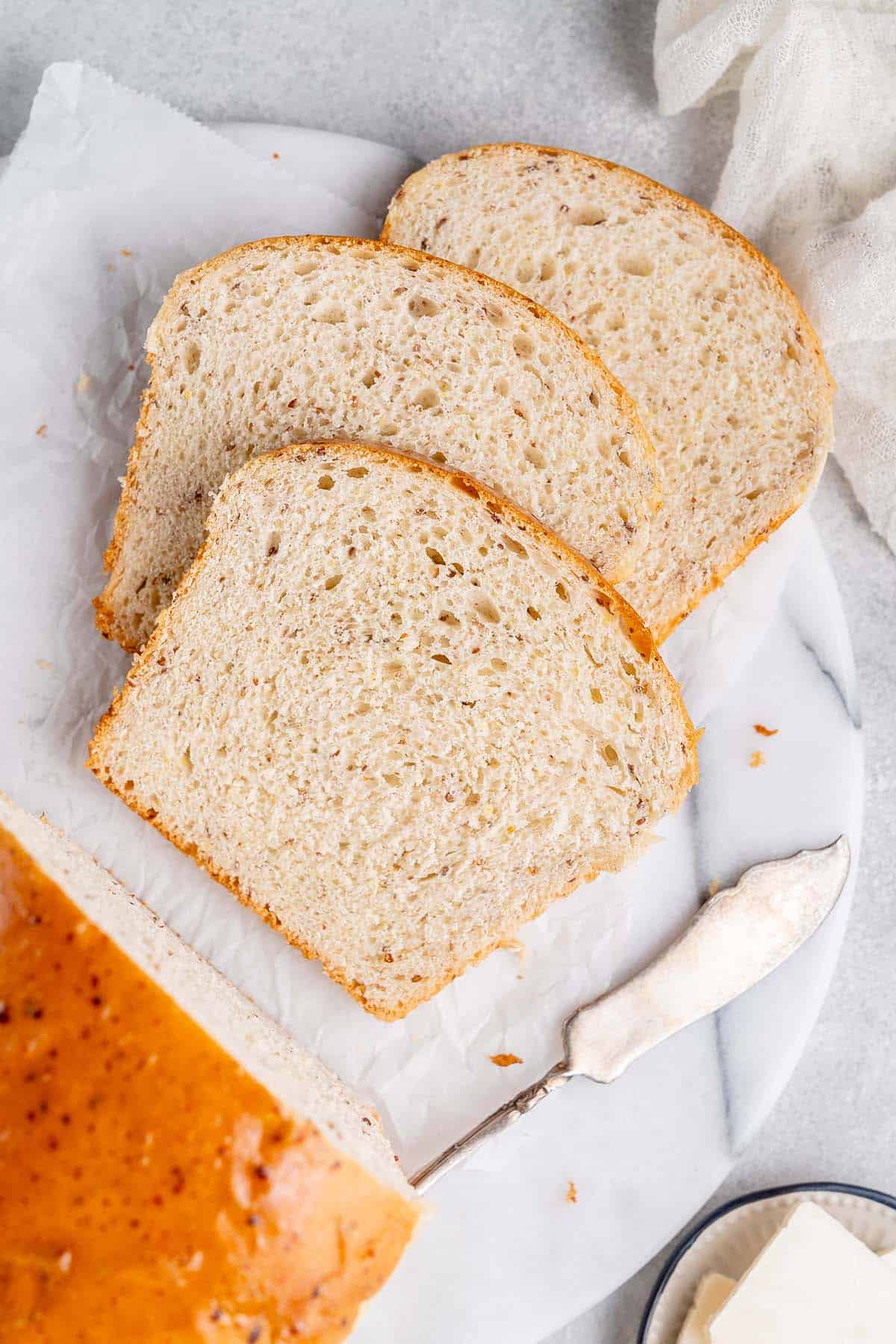 slices of vegan sandwich bread on white marble board