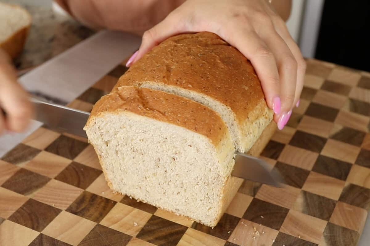 slicing vegan sandwich bread