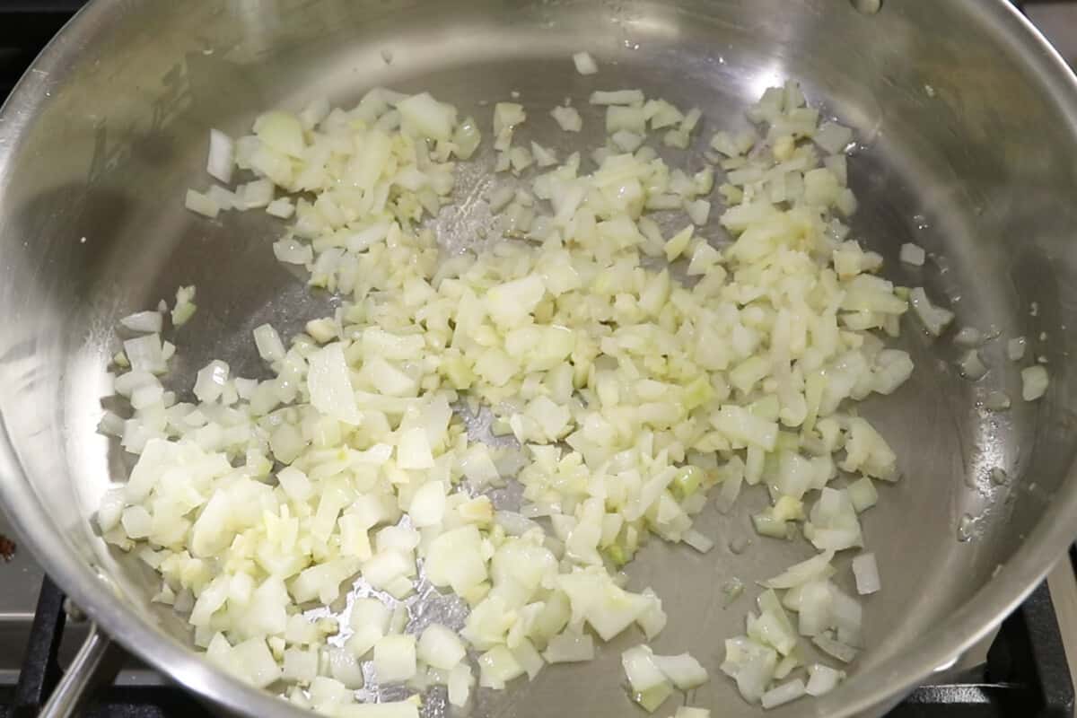 cooking onions and garlic for lumpiang gulay