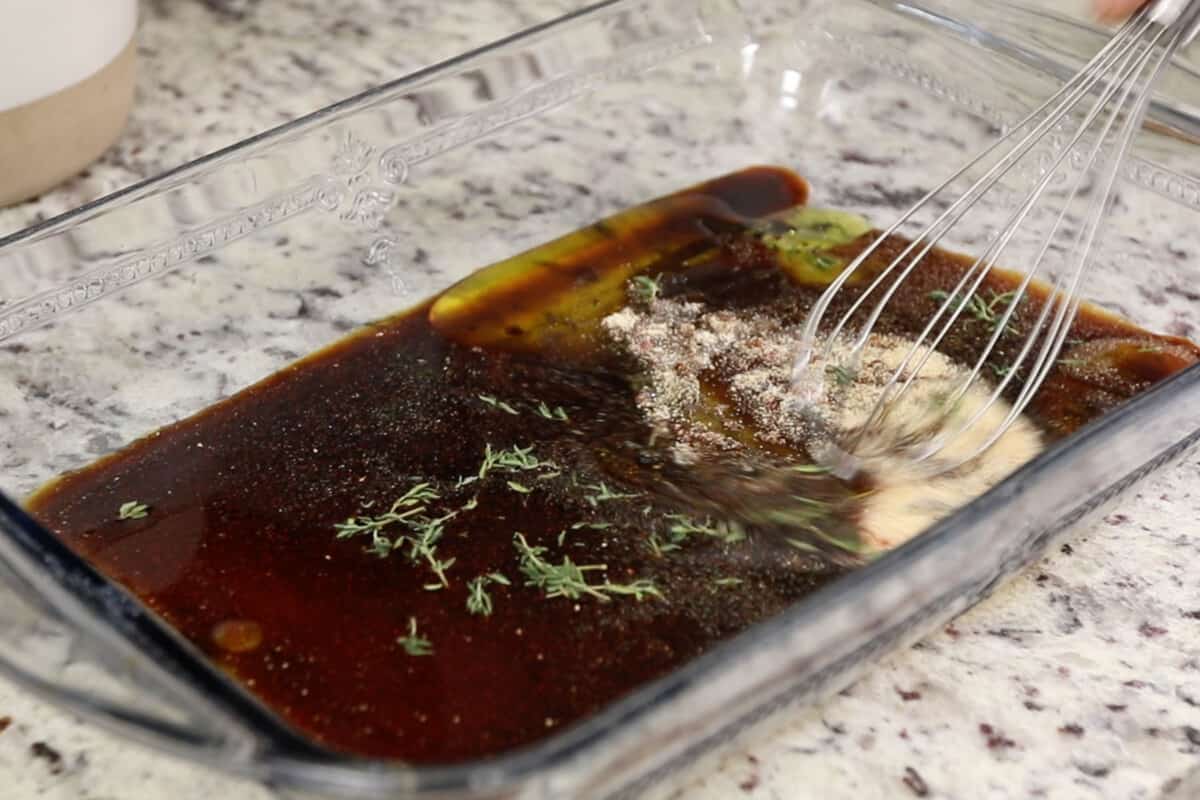 mixing marinade for mushrooms in glass dish