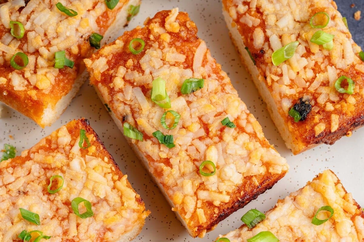 overhead image of gochujang garlic bread with green onions on top