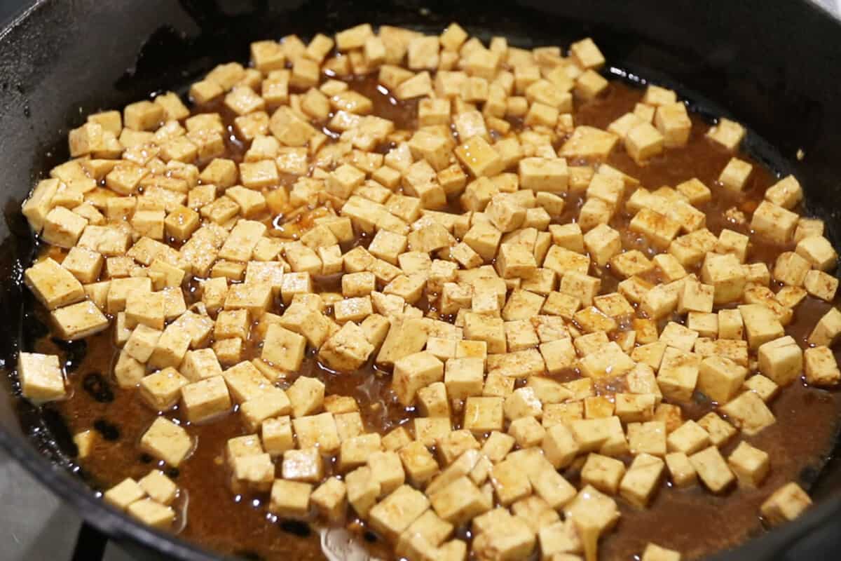making tofu pancetta in cast iron skillet for carbonara