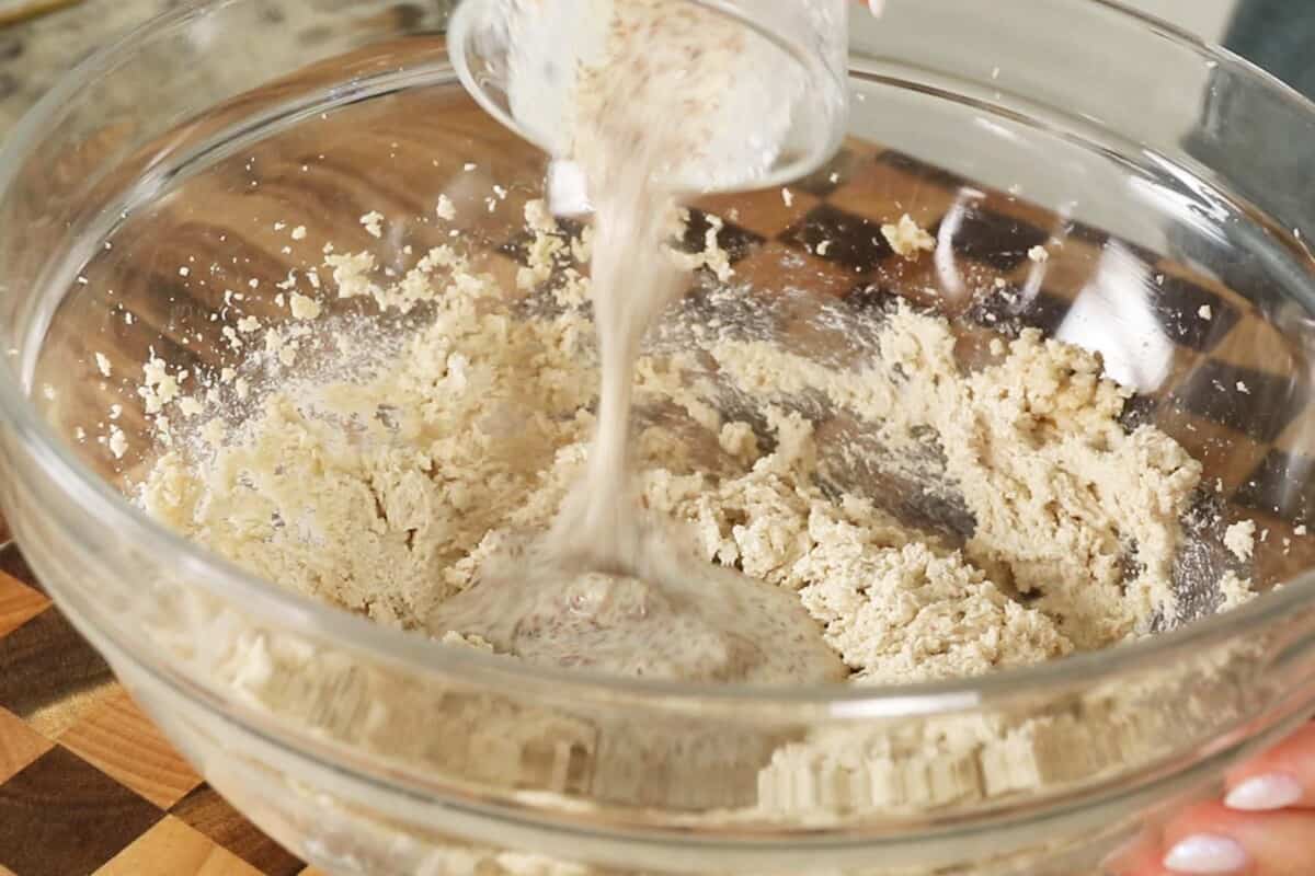 making coconut sugar cookie dough in glass bowl