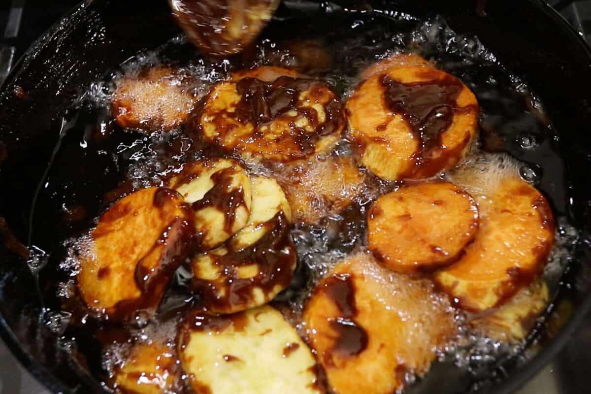 frying sweet potatoes and brown sugar for filipino kamote cue