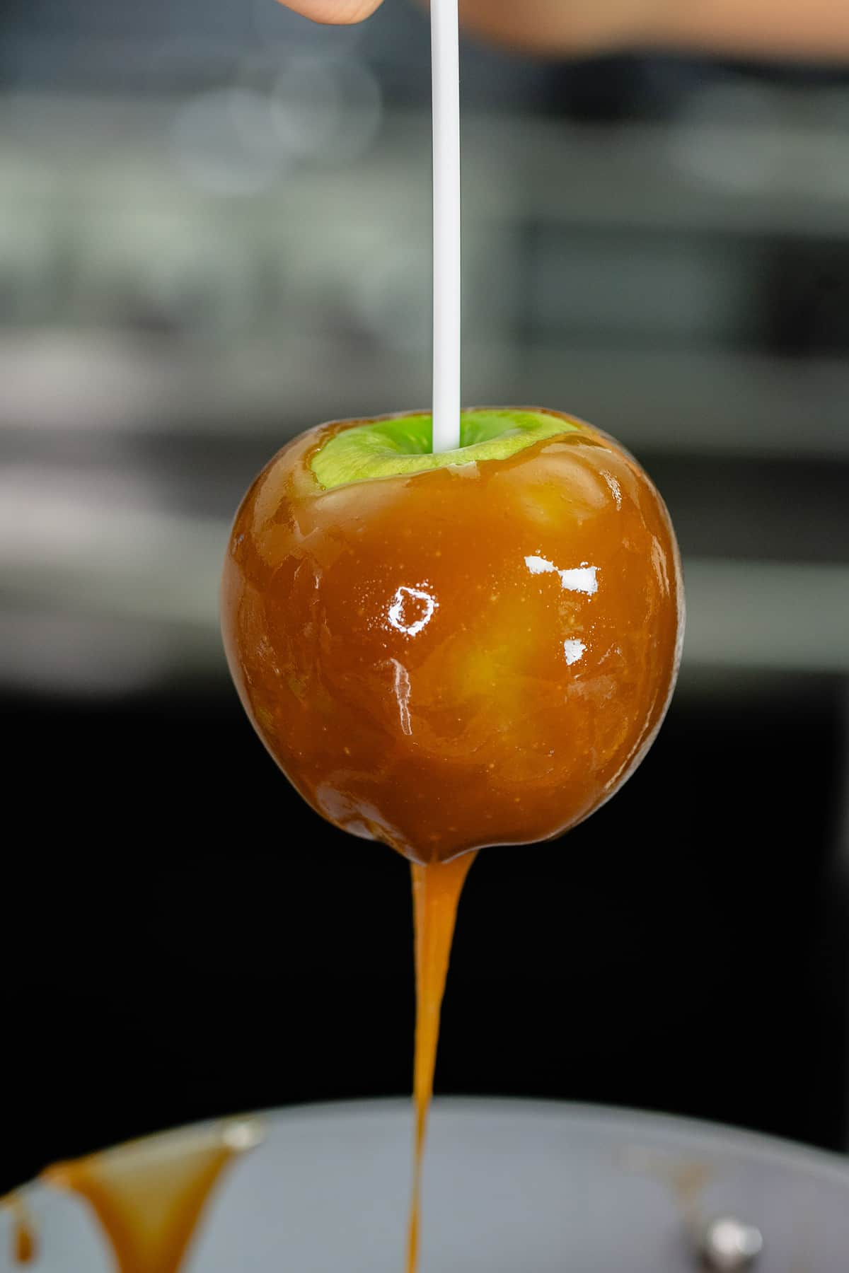 green apple dripping with fresh caramel