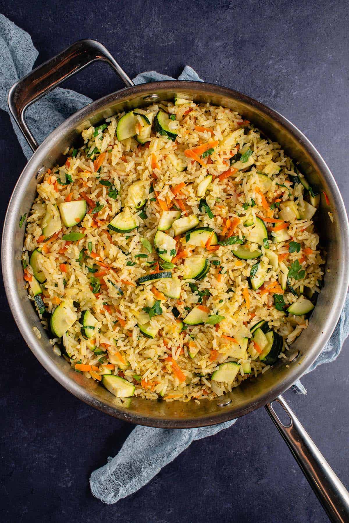 pot full of rice pilaf on a blue napkin