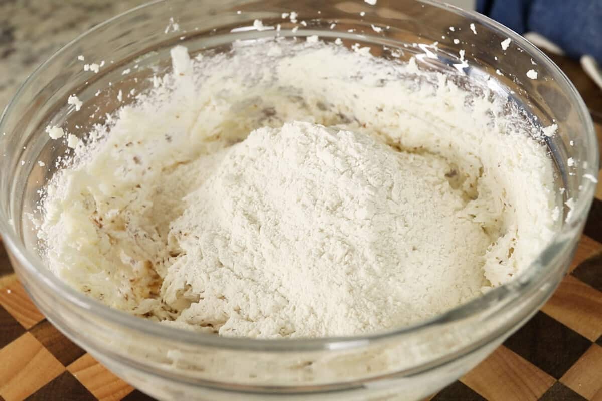 step by step - flour added to bowl of creamed butter and sugar