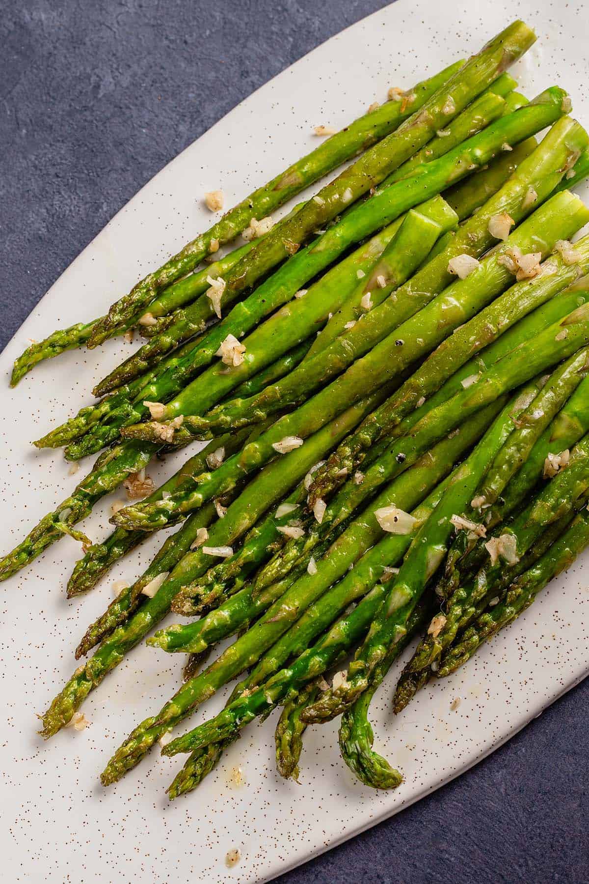 Pan-Fried Asparagus on white tray