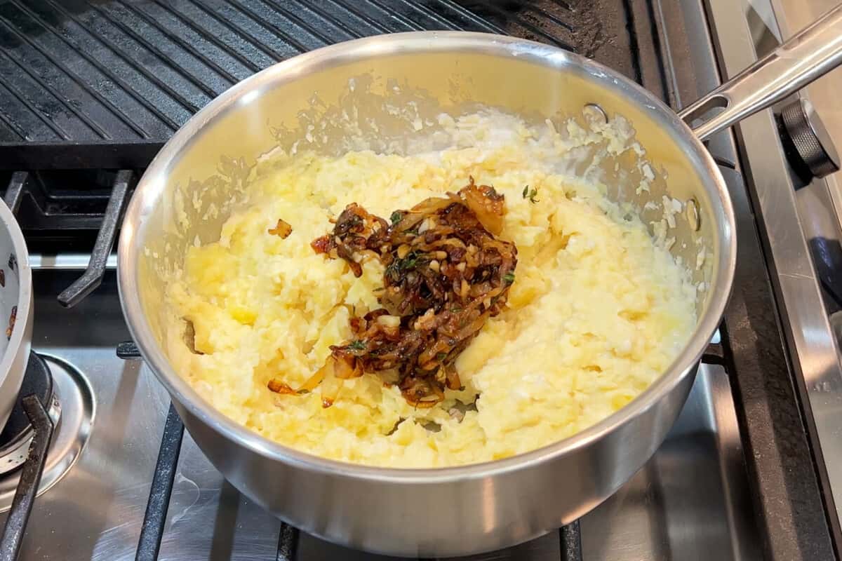 making french onion mashed potatoes in stainless steel pot