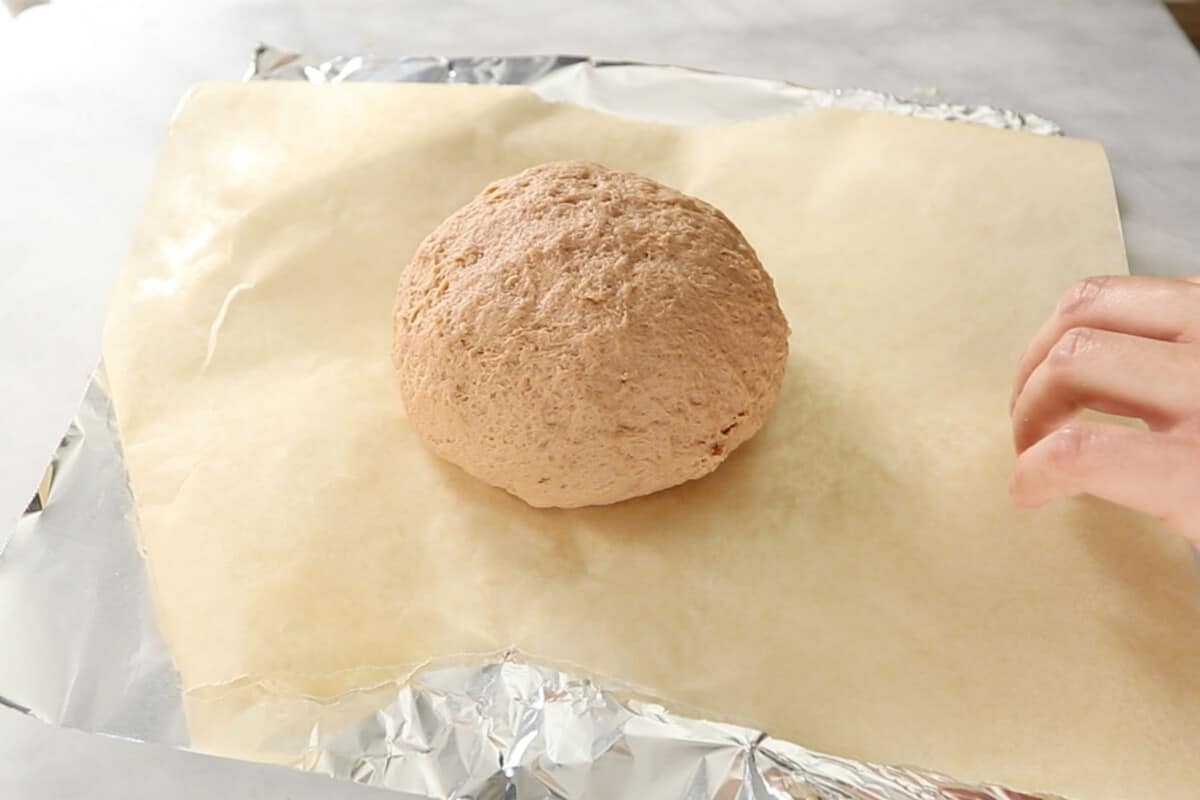 uncooked roast on parchment and foil