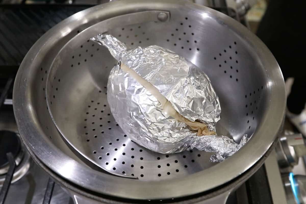 roast wrapped in parchment and foil in steamer basket