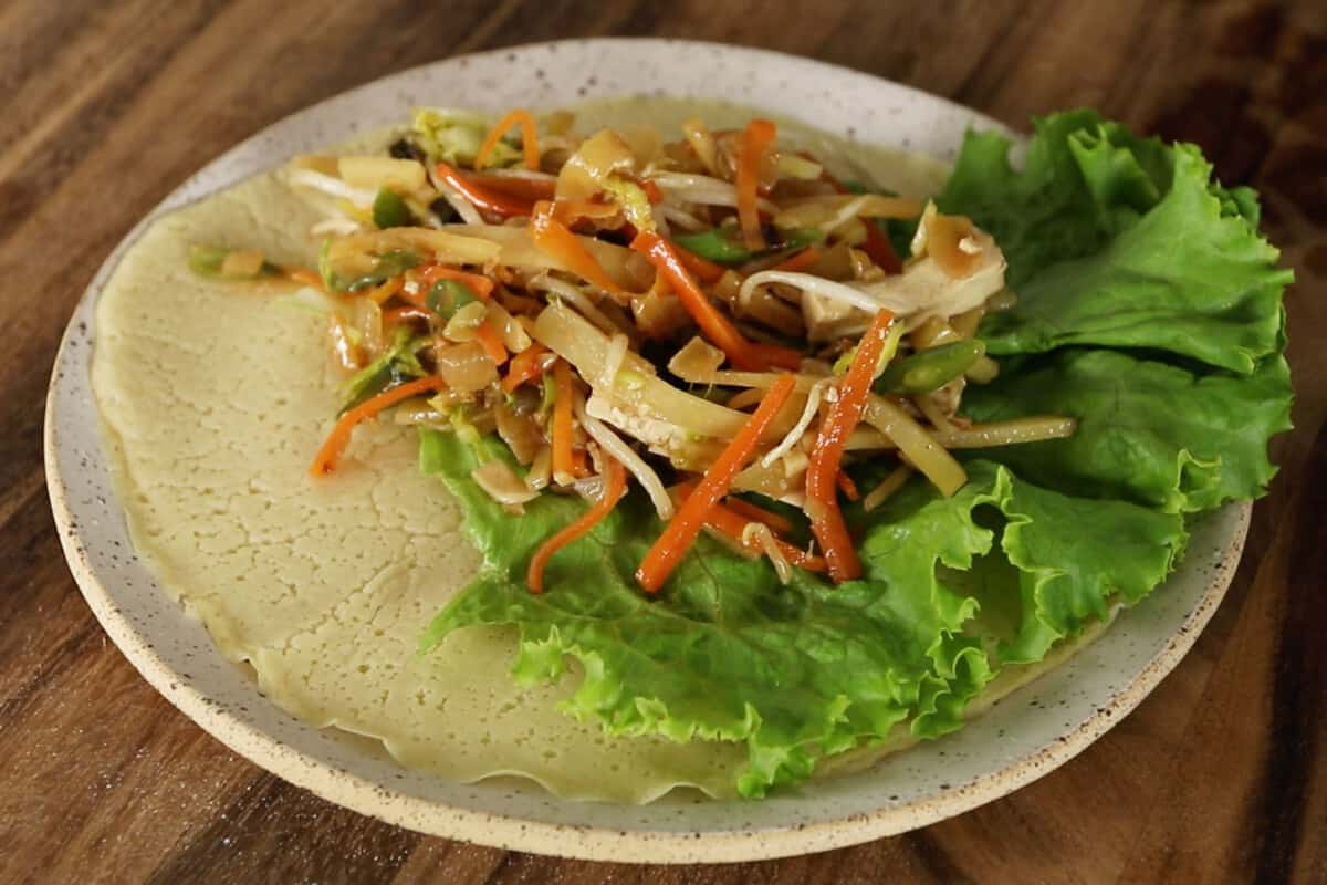 step by step - vegetables on lettuce in fresh lumpia wrapper