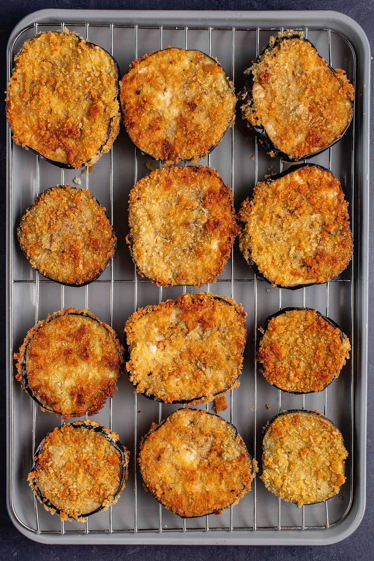 fried eggplant rounds on cooling rack