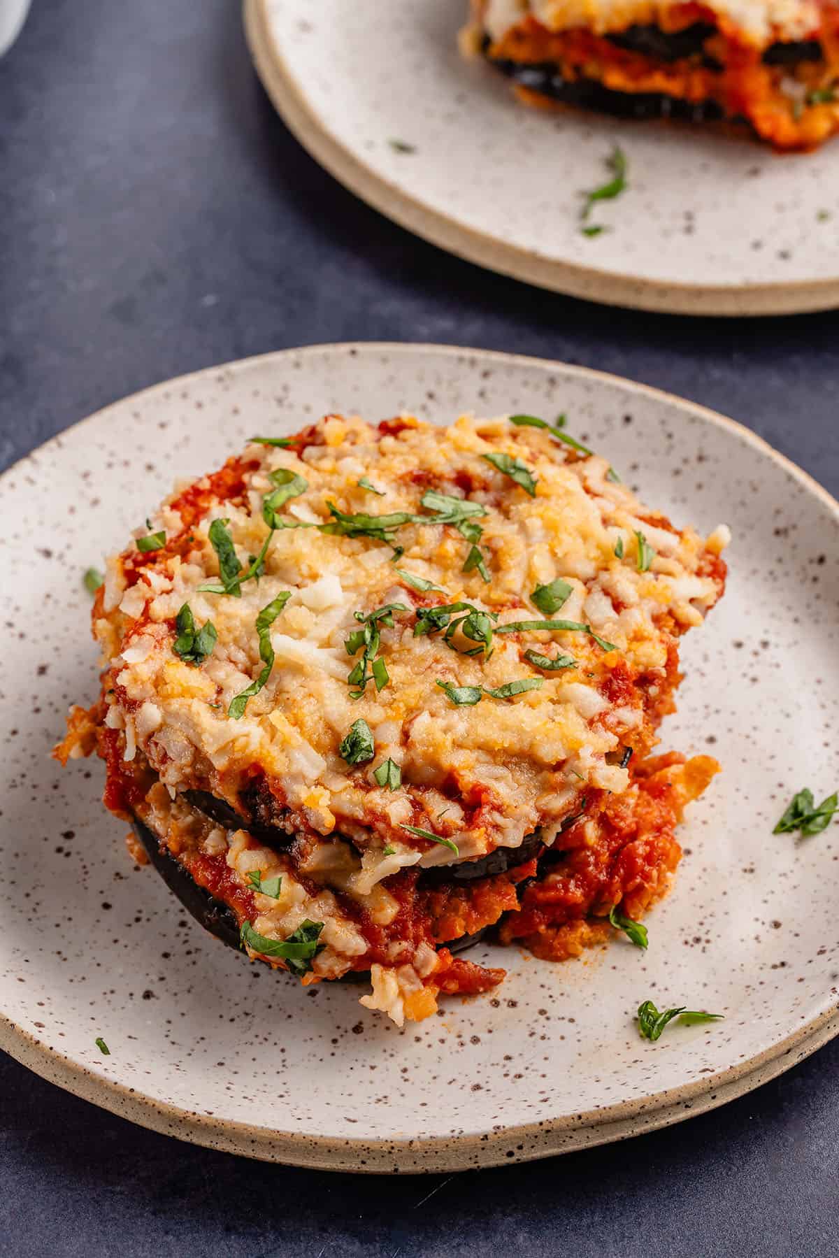 single serving of eggplant parm on on a plate