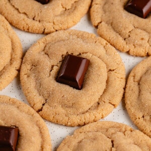 peanut butter blossom cookies on white tray sitting closely together