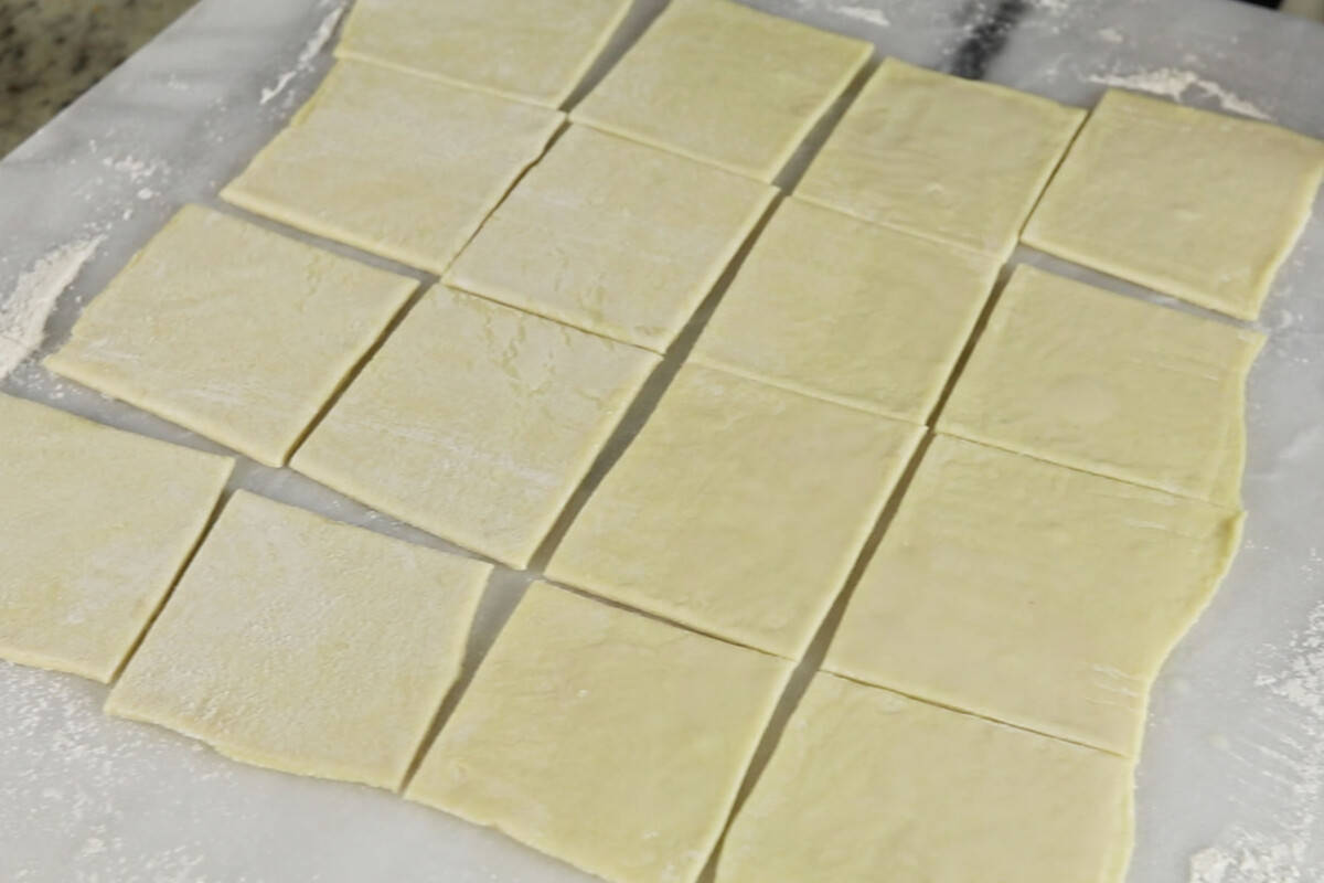 cutting puff pastry into cubes