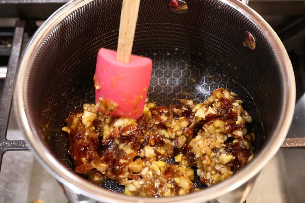 step by step: mixing nut and date filling in a pot