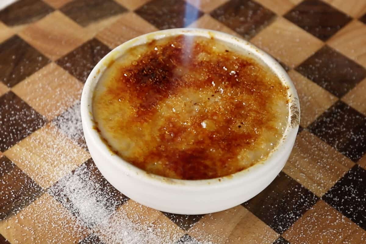 caramelizing sugar with kitchen torch for creme brulee
