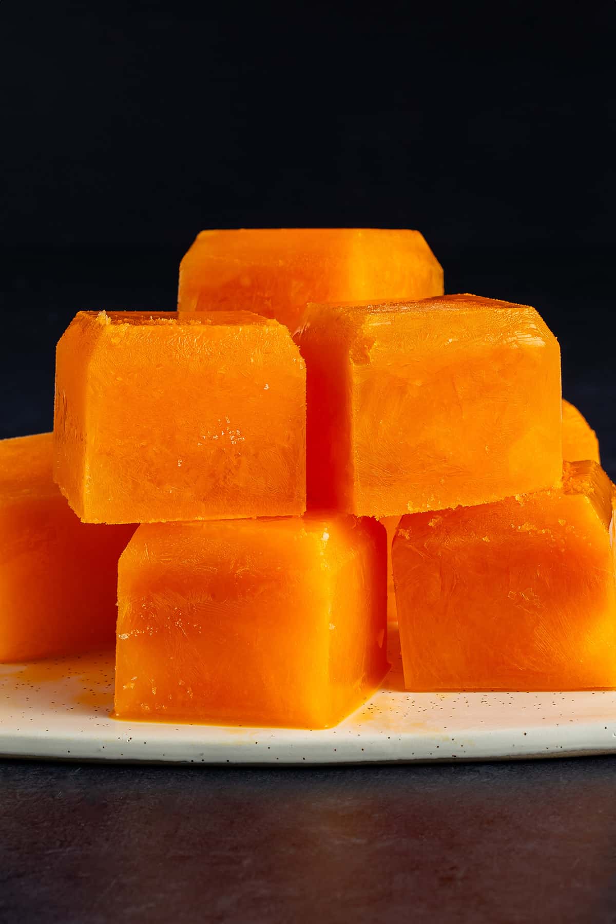 frozen immunity juice cubes stacked on white serving platter