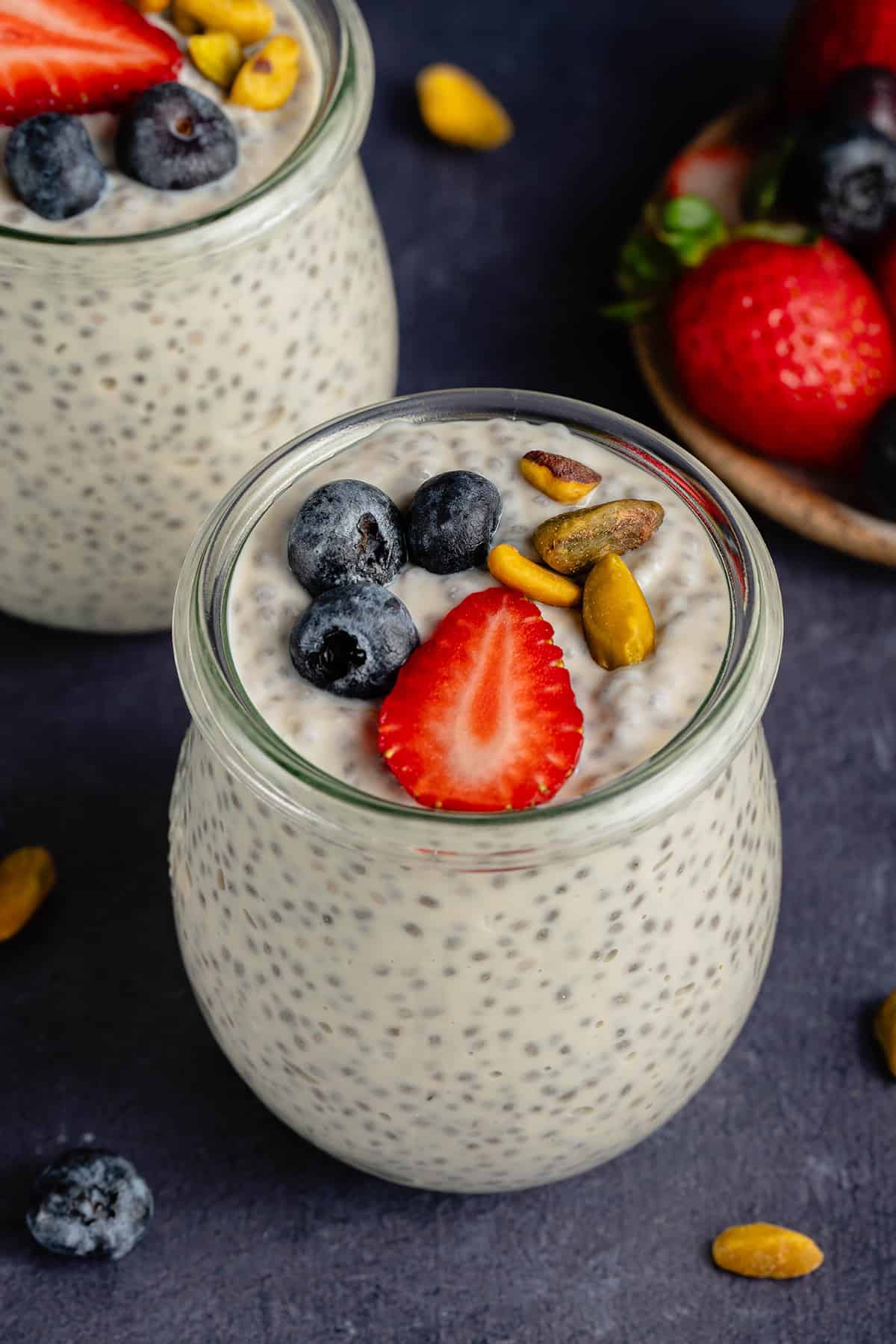 Vegan Chia Pudding with Yogurt in glass weck jar with fruit and nuts